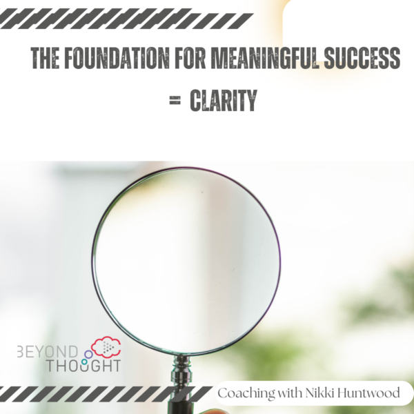 magnifying glass with the words the foundation for meaningful success = clarity