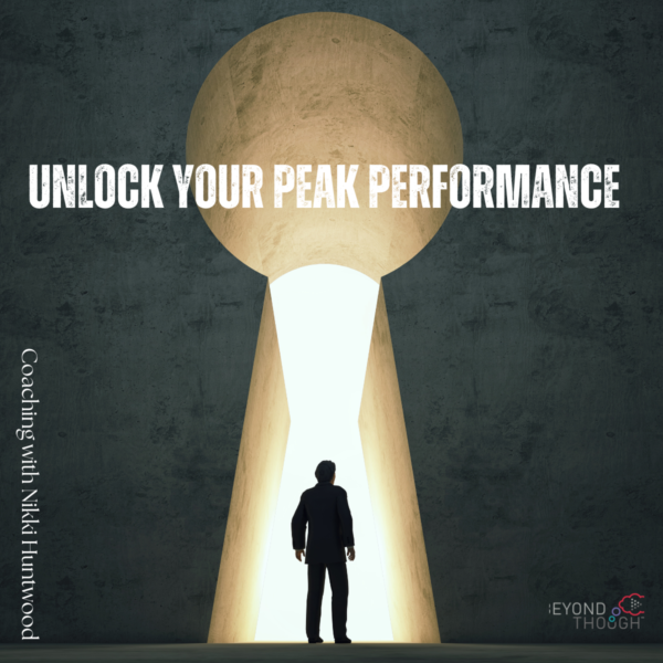 Picture of a man under a giant keyhole with the words "Unlocking Your Peak Performance"